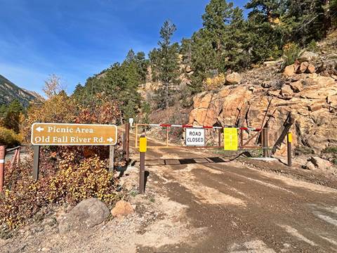 A gate is closed across the entrance to Old Fall River Road